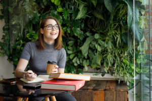 Millennial woman working in a coffee shop