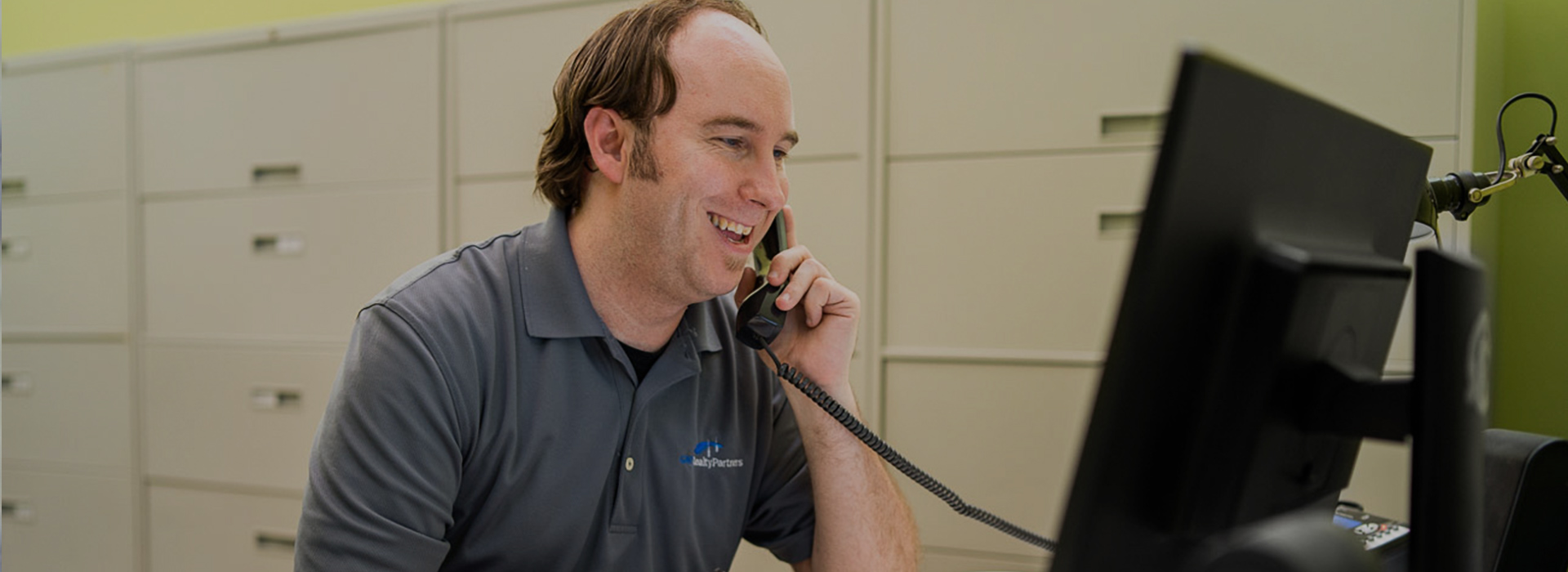 GNP Realty employee talking on the phone