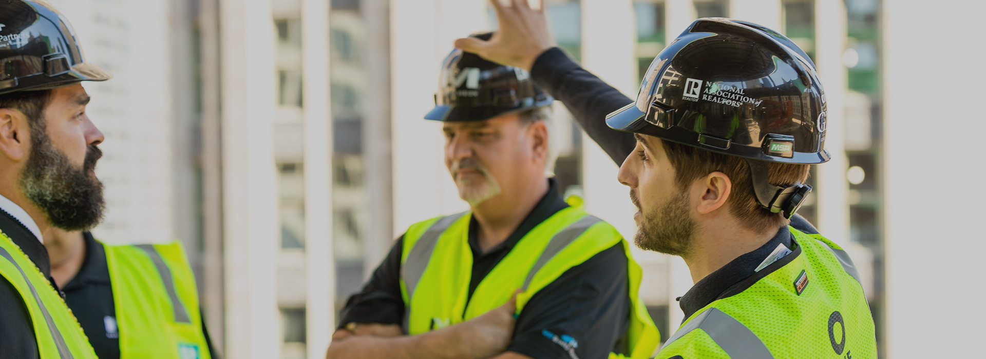 GNP Realty team in hardhats and high visibility vests