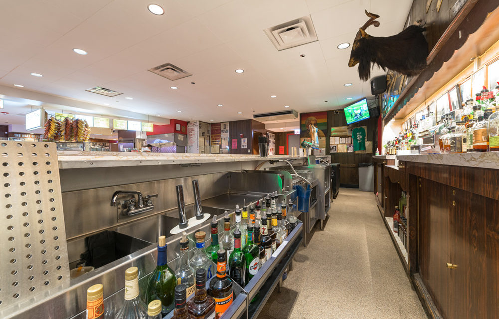 Liquor bottles behind the bar at The Billy Goat Tavern