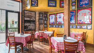 Pizano's restaurant with multiple tables and a variety of Chicago Cubs memorabilia on walls
