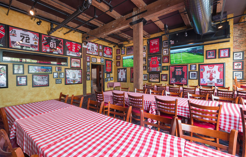 Large table with checkered tablecloth at Pizano's Restaurant